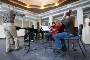 Zach Stanton rehearses members of Iowa's Center for New Music ensemble.